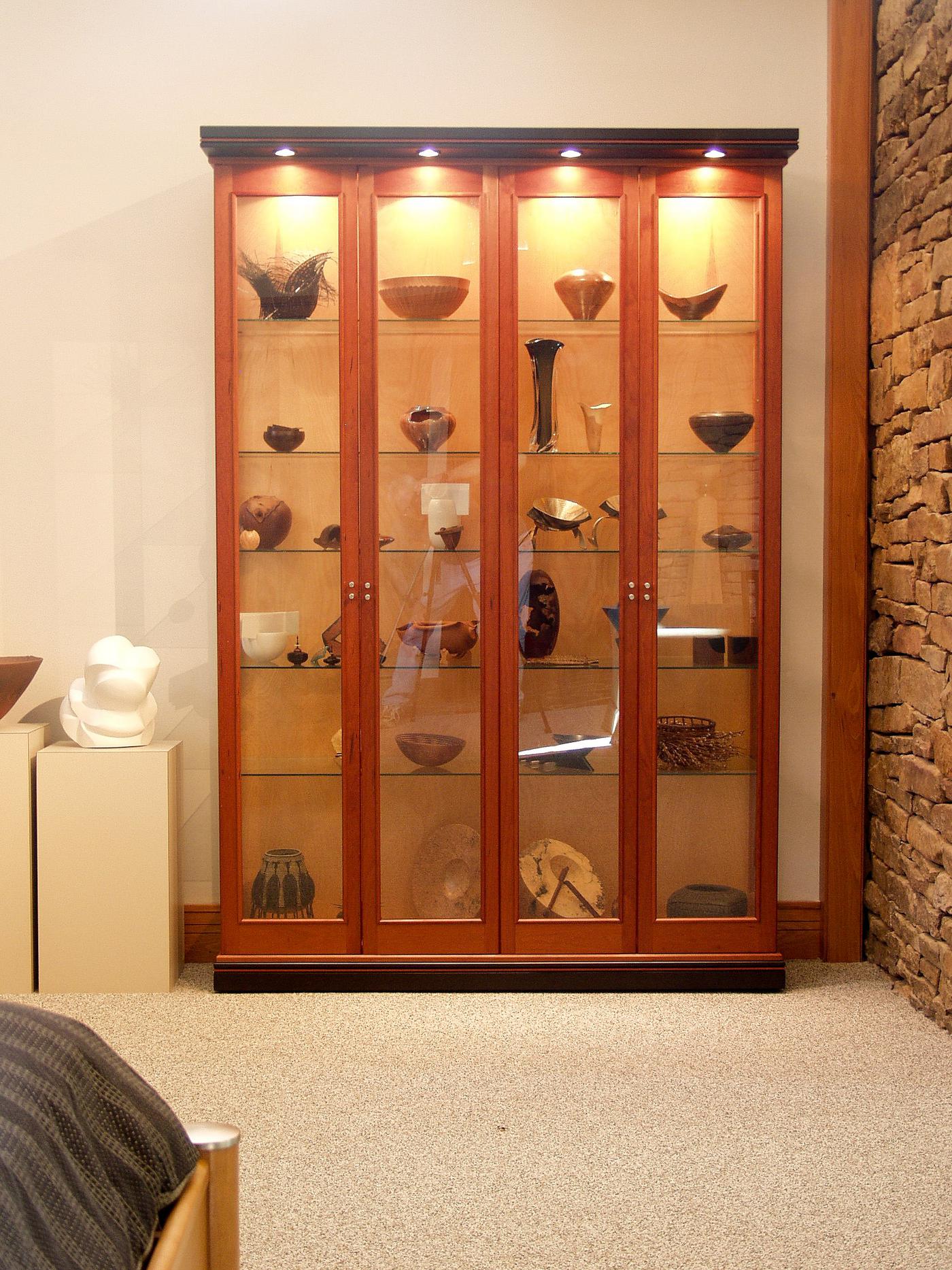 Lighted cherry display cabinet for art collection